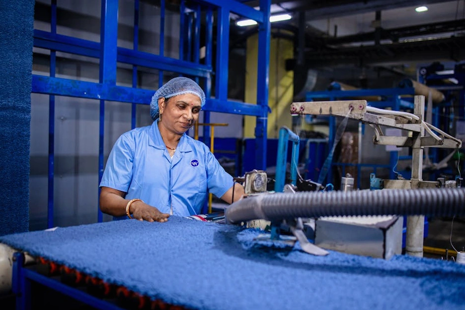 A professional consultant discussing a flowchart with a factory manager.